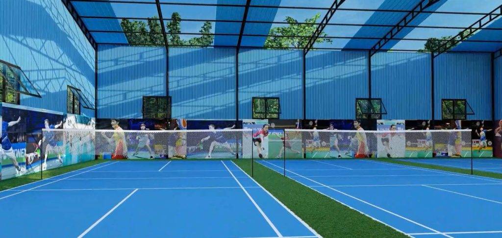 A Professional Badminton Arena Nexora Structure Ltd featuring multiple blue courts, green turf borders, and high-quality net systems under a blue-pane led roof.
